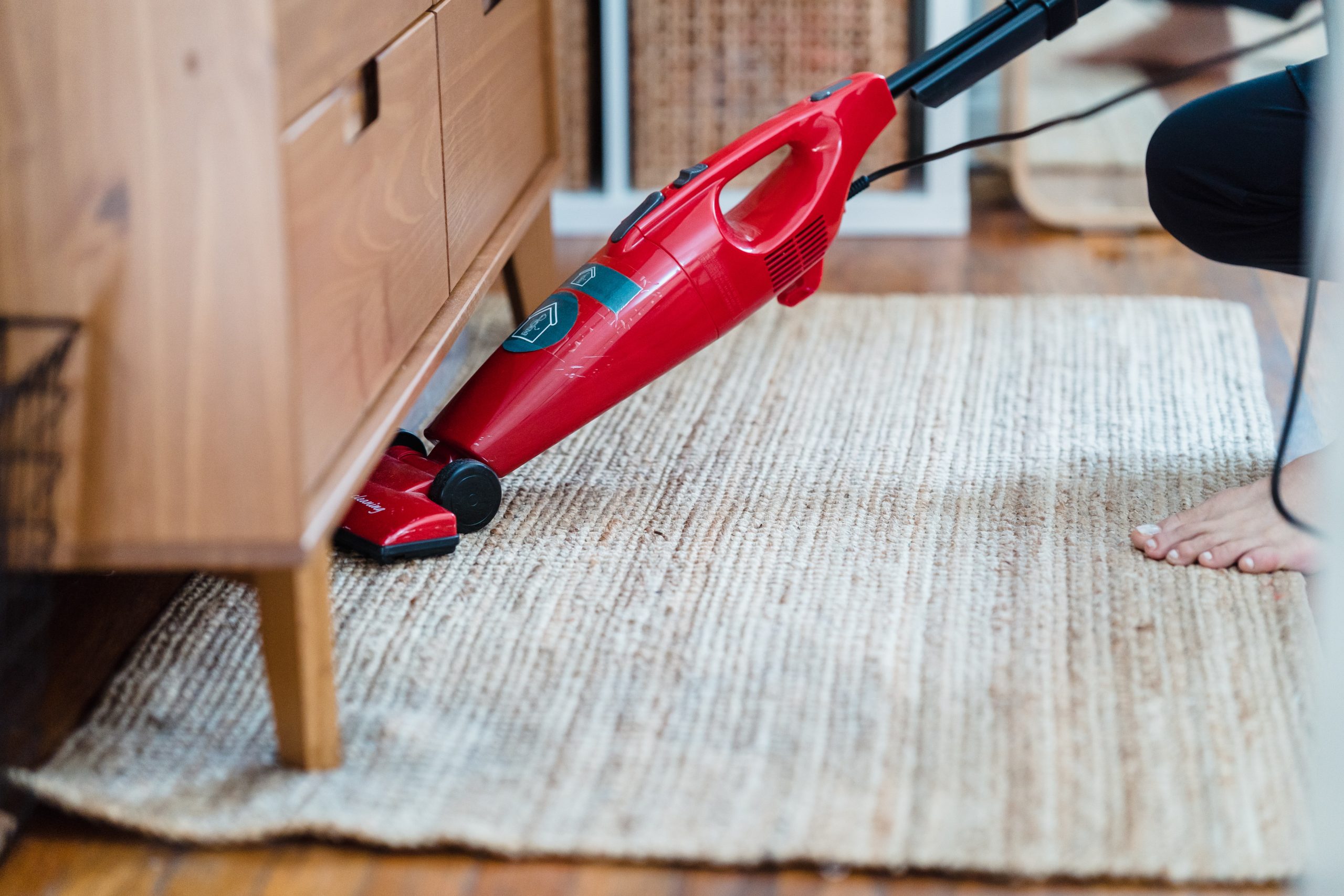 Vacuum cleaning the rug